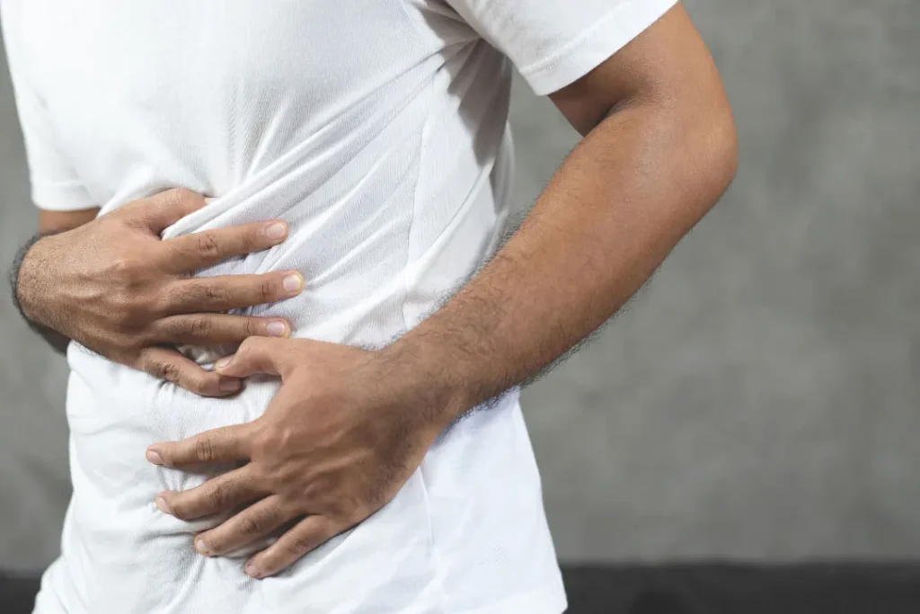 man suffering from stomach pain