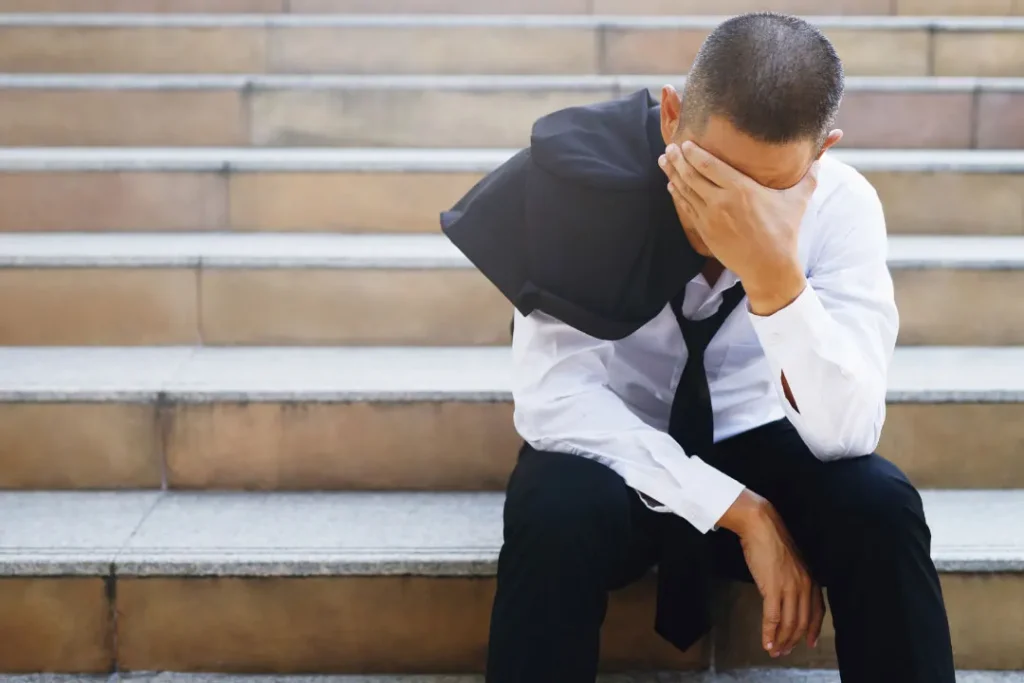 stress man sitting on stairs