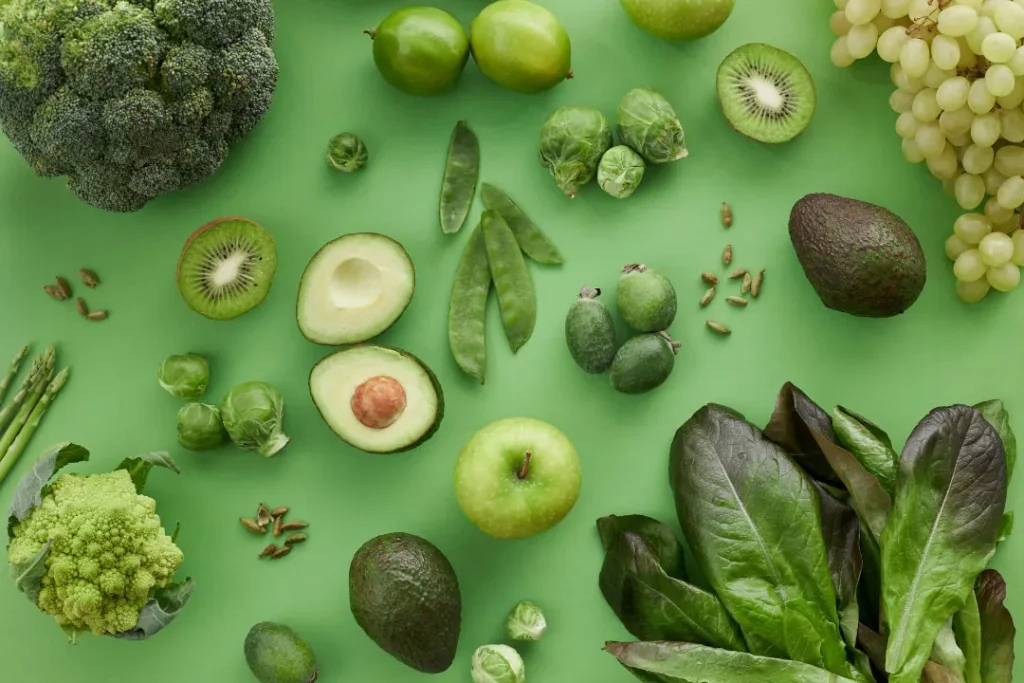 green vegetables and fruits with green background