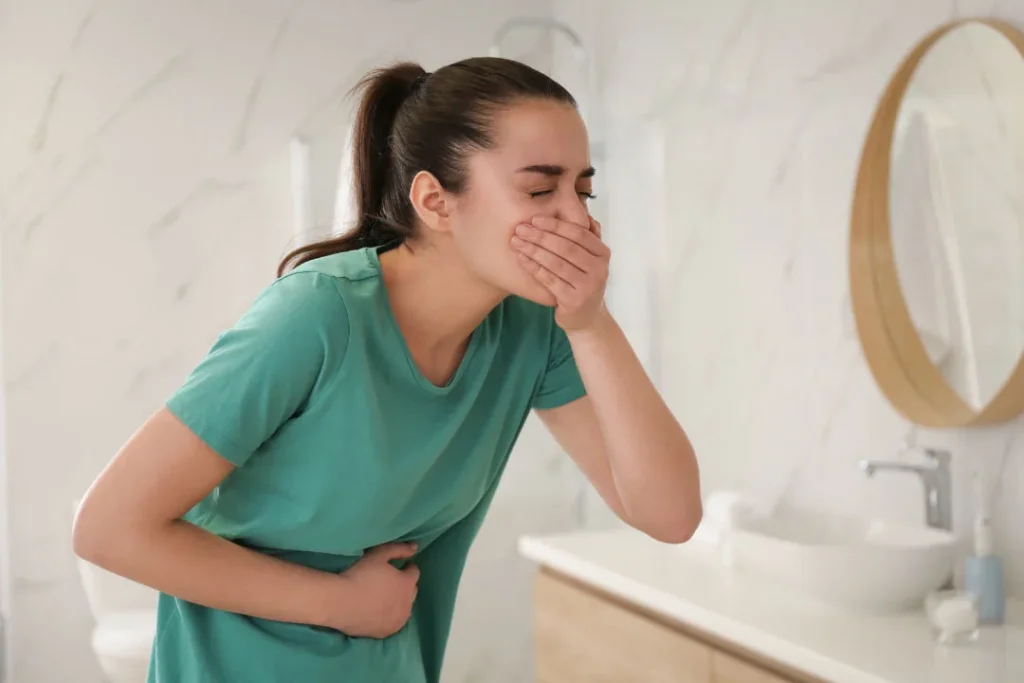 A girl doing vomiting. 