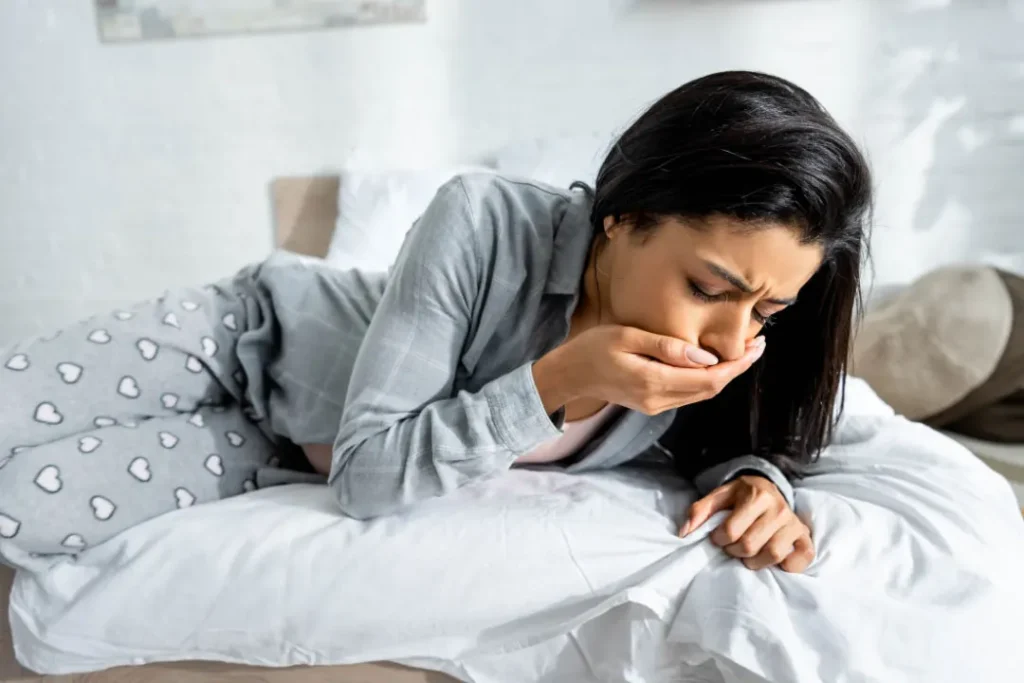 A lady doing vomiting. 