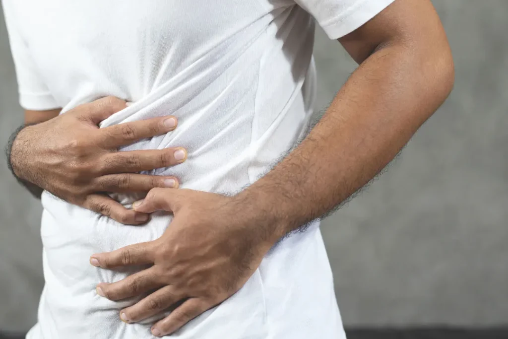 man suffering from stomach  pain