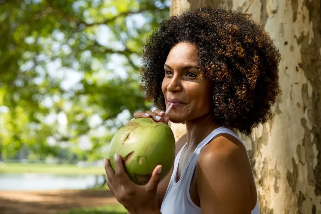 women drinking Coconut Water