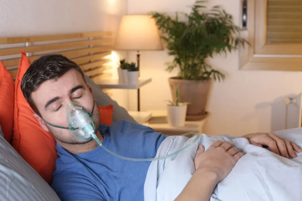 A man having oxygen mask for proper breathing. 