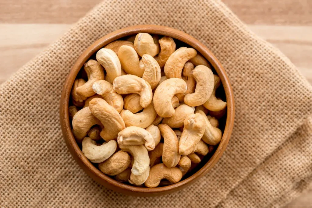 Cashews in wooden bowl.