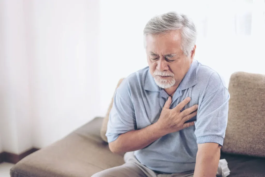 An old man having pain in heart. 