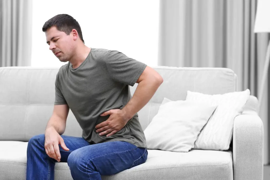 A man facing pain in his belly. 