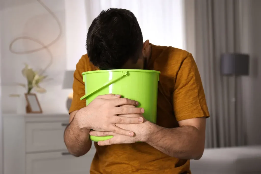 A man having vomit. 