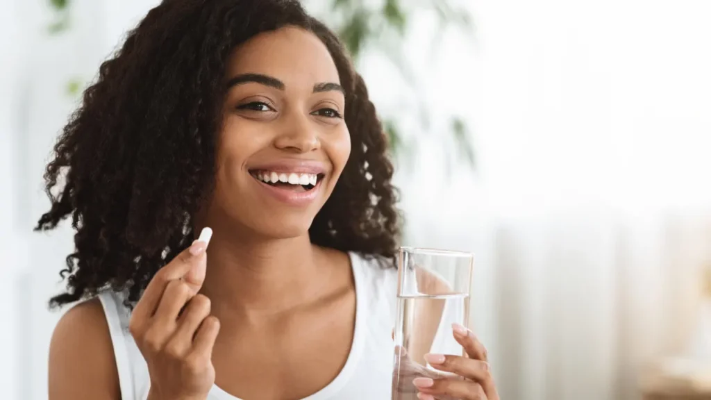 Lady having supplement. 