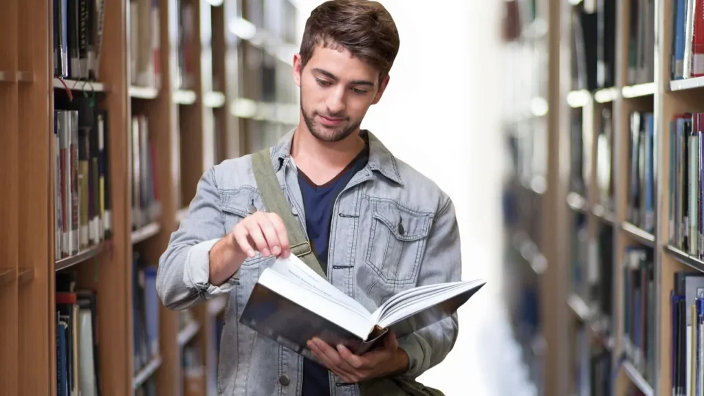 Man is reading a book. 