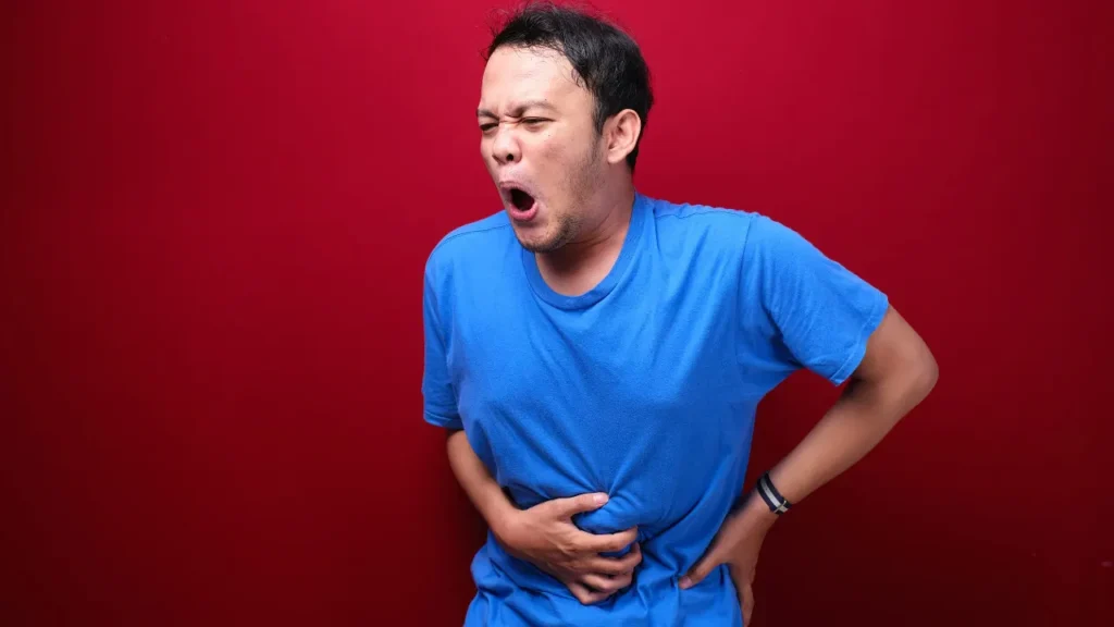 Man having gastrointestinal pain. 