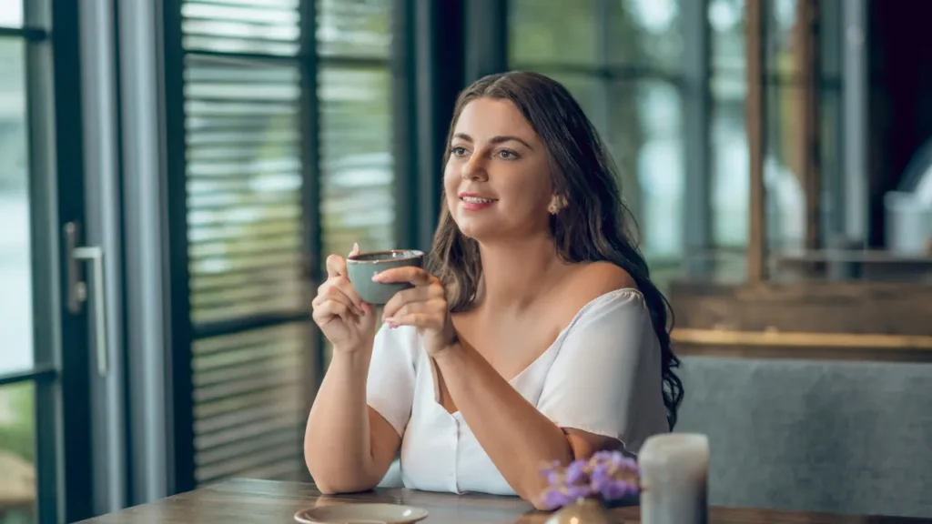 Lady having a cup of tea. 