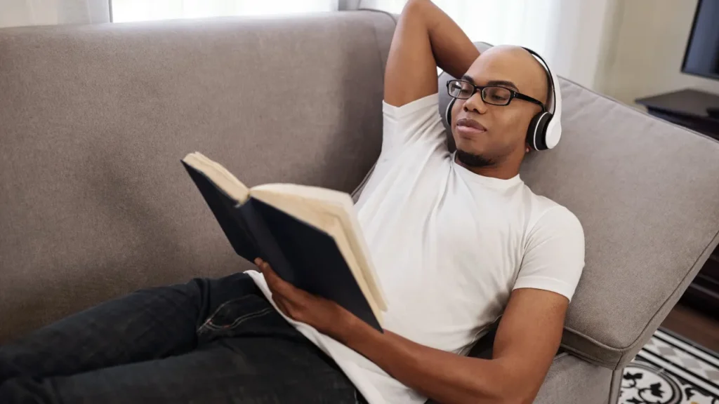 Young man reading a book.