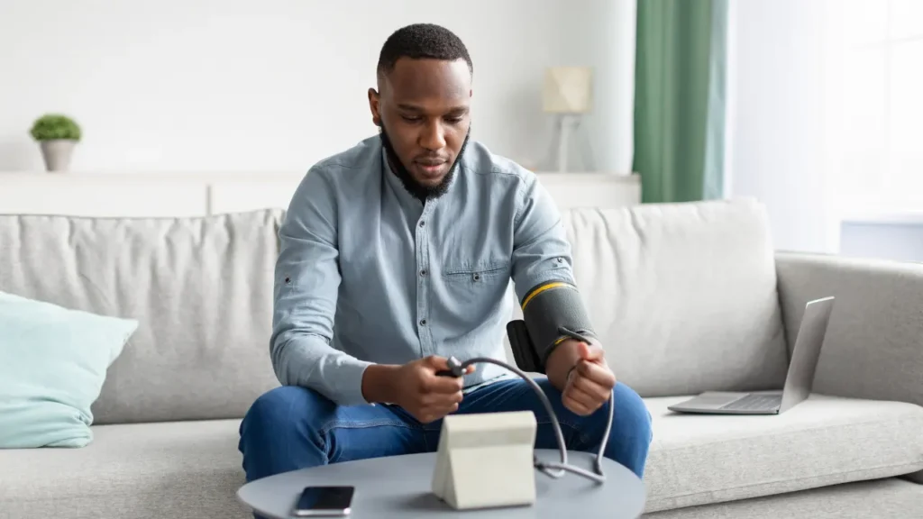 Man is checking his blood pressure. 